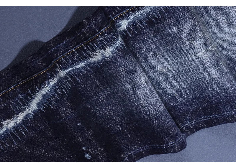 Fashionable men's deep blue jeans with scratches, washed water, nostalgic stretch, slim fit, painted jeans, designer high street