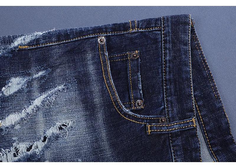 Fashionable men's deep blue jeans with scratches, washed water, nostalgic stretch, slim fit, painted jeans, designer high street