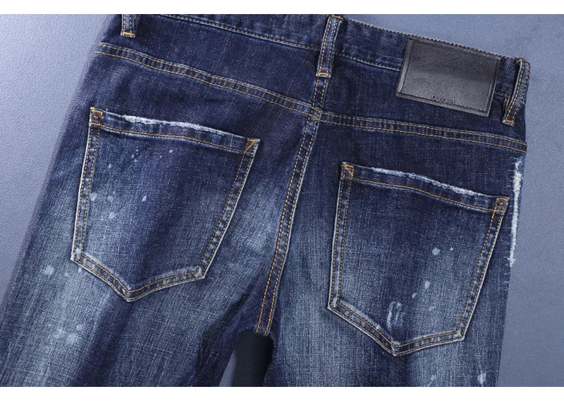 Fashionable men's deep blue jeans with scratches, washed water, nostalgic stretch, slim fit, painted jeans, designer high street