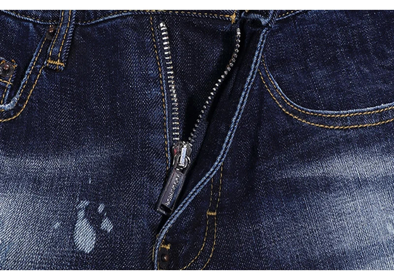 Fashionable men's deep blue jeans with scratches, washed water, nostalgic stretch, slim fit, painted jeans, designer high street